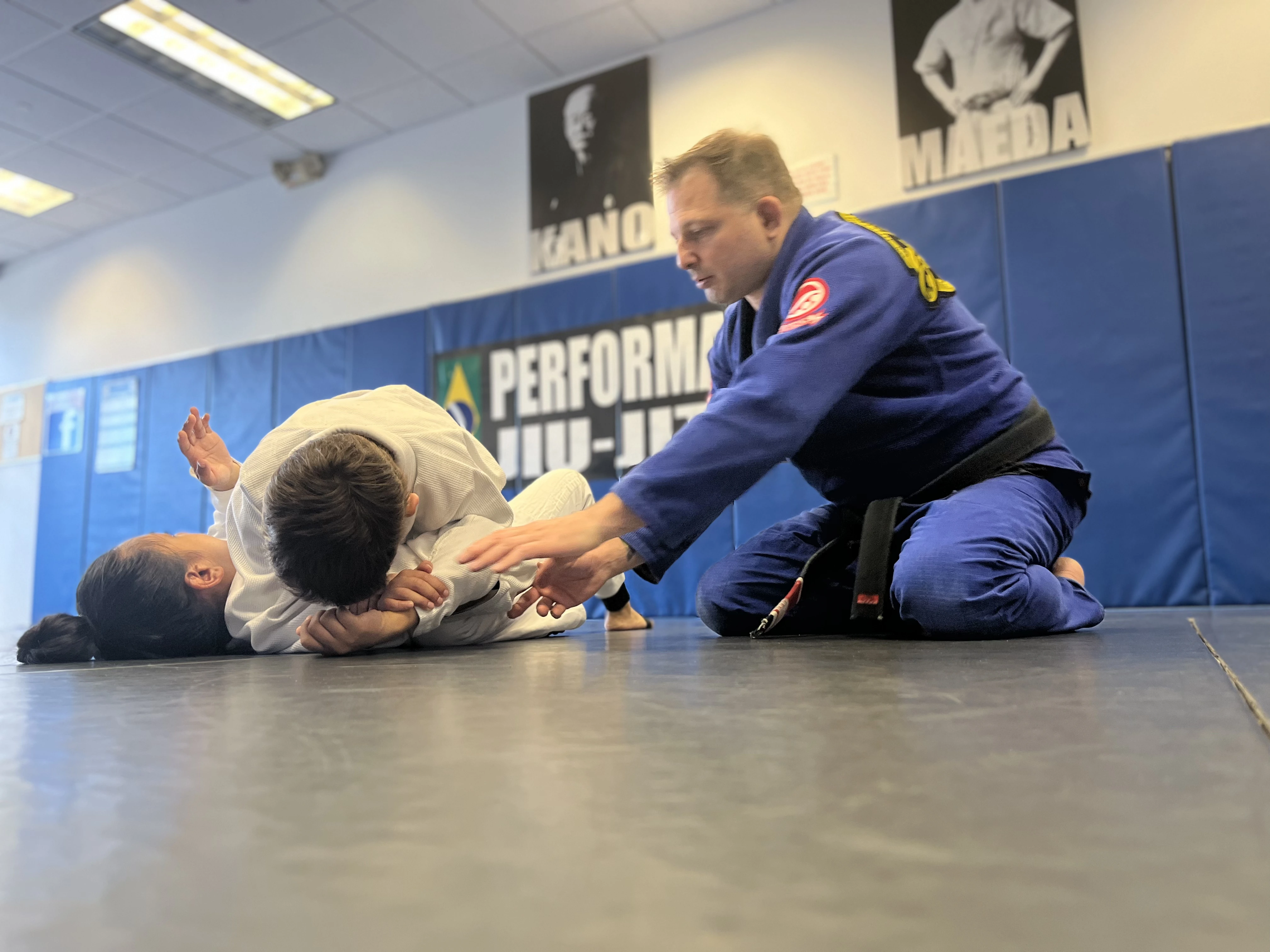 Kids drilling Brazilian Jiu-Jitsu with their instructor at Performance Jiu-Jitsu in Fair Lawn, NJ